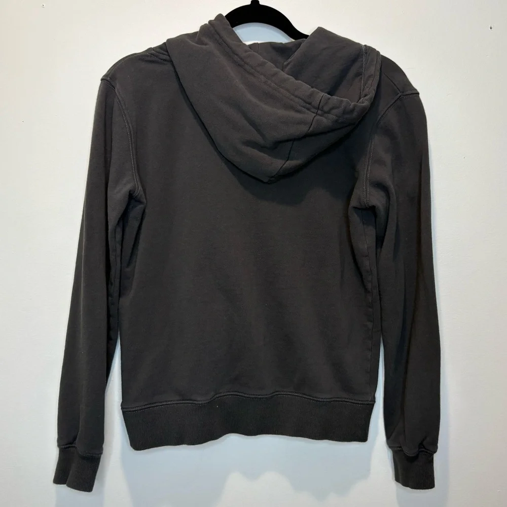 Converse Gold Standard Loose-Fit Pullover Hoodie in black with a gold logo.